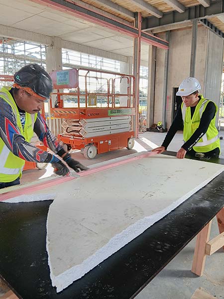 MAGS student Daniel at Liston College site with Cassidy Construction