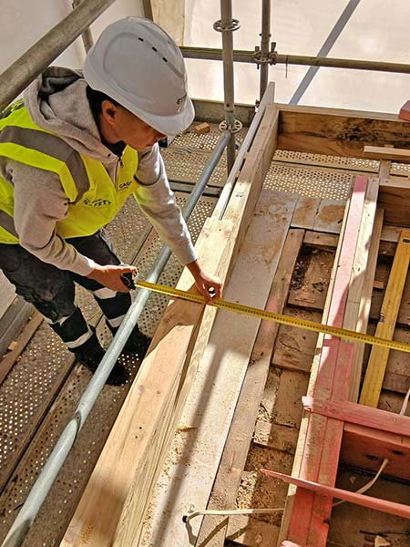 MAGS Gateway Student Kobe measuring framing timber on Cassidy Construction site