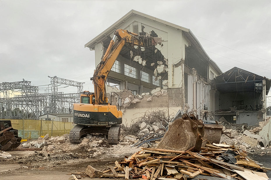 excavator demolishing the transpower control room at penrose auckland