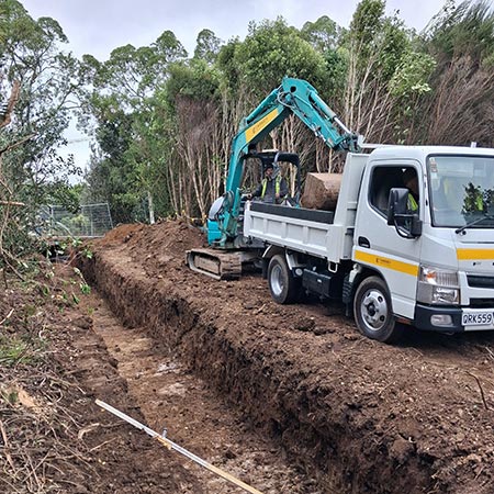 cassidy excavator digging a trench and loading a truck