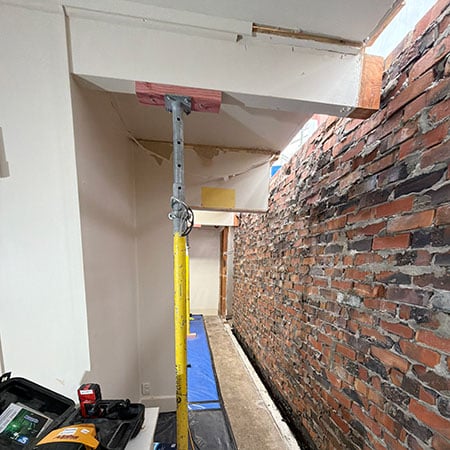 detail of original brick wall and interior renovation